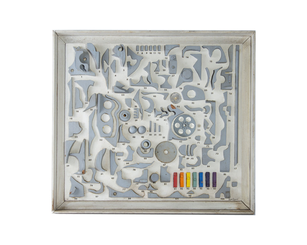 A signed assemblage wall sculpture by the American artist James Spencer Russell (1915-2000). Signed "James Russell May 1965", this assemblage primarily features cut and painted white wooden shapes upon a white wooden board. There are seven colorful rainbow painted wooden pieces in the right hand corner of the composition. The assemblage has a thin white wooden frame. Ruth White Gallery information label on verso.